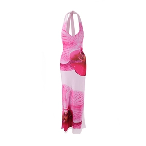 Detail of pink halter neck maxi dress featuring large orchid floral print and slim fit