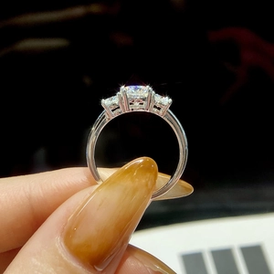Elegant 925 sterling silver three-stone ring with a 1-carat round moissanite center stone