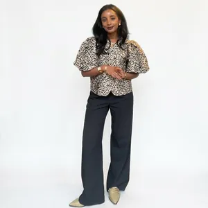 Chic leopard print v-neck shirt with puff sleeves paired with black wide leg trousers