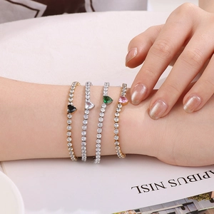 Exquisite heart-shaped zircon tennis bracelets in gold and silver worn by a female model
