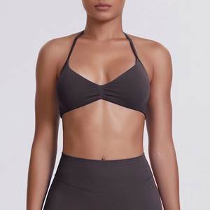 Close-up of seamless dark grey halter sports bra showing high-elasticity fabric detail