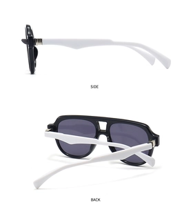 Side and back view of retro two-tone sunglasses with black frame and wide white temples