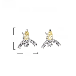 Detail view of teardrop zircon earrings with 11mm height dimensions and material specs