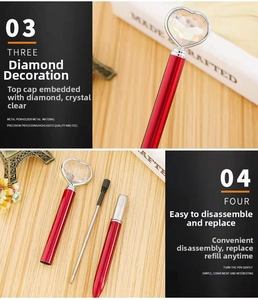 Detail showing the red metal ballpoint pen with a heart-shaped diamond and detachable parts