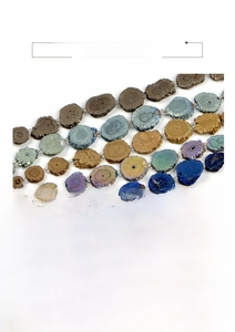 Detailed view of tower-shaped natural quartz beads in metallic blue and bronze tones