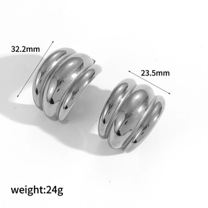 Polished silver geometric hoop earrings in chunky C-shape with ribbed texture for women
