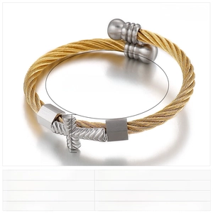 Detail view of twisted stainless steel wire bracelet with silver cross and square charms