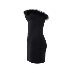 Close-up of fluffy black feather trim on a sexy bodycon strapless tube mini dress
