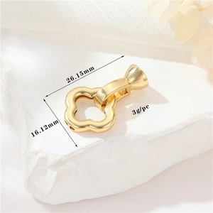 Detailed view of 14K gold-plated clover jewelry clasp with exact measurements