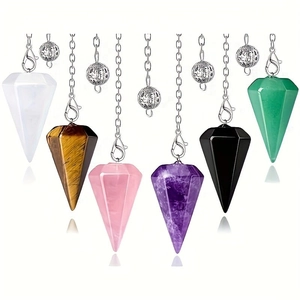 Set of six hexagonal crystal stone dowsing pendulums including tiger eye and amethyst