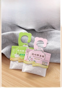Hanging lavender sachet with jasmine and rose scent packets on wooden desk