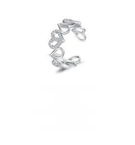 Detailed view of 925 sterling silver open ring with pavé heart pattern and S925 stamp