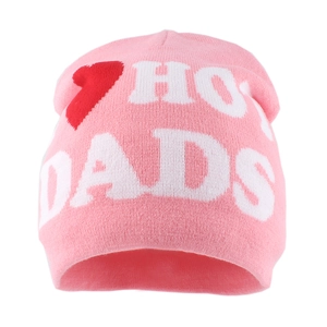 Detailed knit texture of bright pink beanie featuring red hearts and white HOT DADS lettering