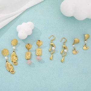 Creative gold sea animal earrings with seahorse charms and elegant white pearls