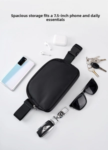 Waterproof nylon belt bag showing interior space for a 7.5-inch phone and essentials