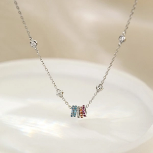 Elegant 925 sterling silver geometric necklace featuring five multi-colored gemstone rings