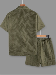 Detail of olive green men's set showing textured geometric knit and short sleeves