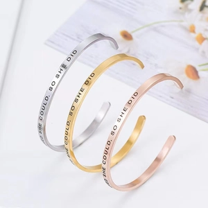 C-shaped stainless steel cuff bracelets in gold, silver, and rose gold with engraving