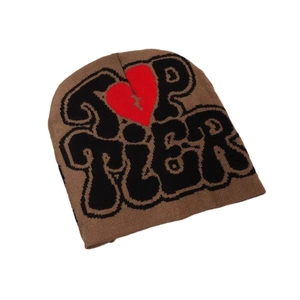 Brown Y2K knitted beanie featuring Top Tier text and a red broken heart graphic print