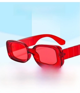 Detail of red rectangle sunglasses featuring thick PC frames and bold wide temples