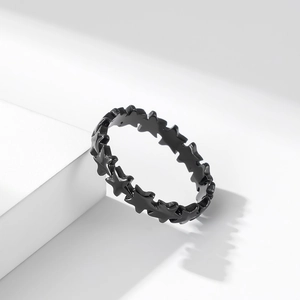 Stackable star-shaped black stainless steel ring featuring a row of pentagram hollow patterns