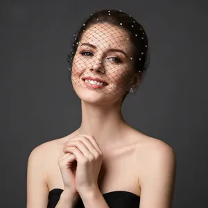 Close-up of black mesh bridal veil headband with small sparkling crystal rhinestones