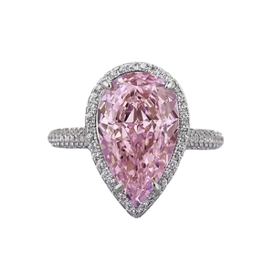Elegant pear-shaped pink gemstone ring with halo diamonds and white gold plated band
