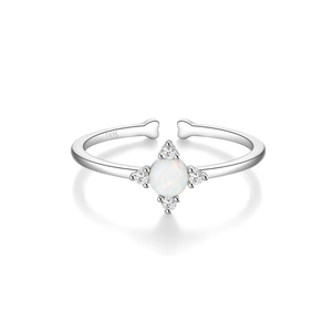 Detail of S925 sterling silver open ring featuring a white opal and zircon starburst design