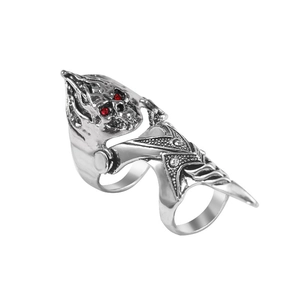 Detail of silver dragon skull armor ring featuring movable joints and red ruby eyes