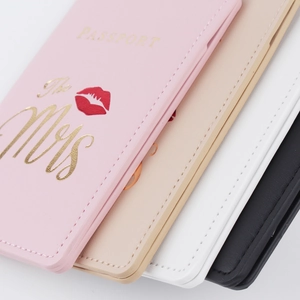 Detail of PU leather passport covers with The Mrs gold foil lettering and edge stitching