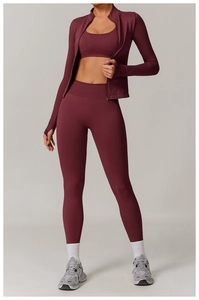 Three-piece dark reddish-brown yoga set featuring high-waisted leggings and zip jacket