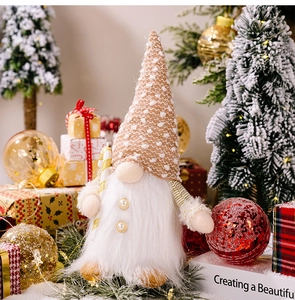 Close-up of a festive Christmas gnome with a brown knitted hat and candy cane decoration