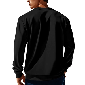 Detail view of the ribbed cuffs and hem on this black corduroy patchwork sweatshirt