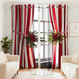Detail of red and white striped Christmas curtain with festive berry tieback and metal rings