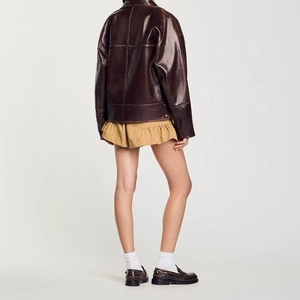 Veste vintage en similicuir marron foncé avec revers asymétrique et coupe ample