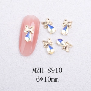 Macro shot of 6x10mm butterfly shaped nail art rhinestones with colorful cat eye stones