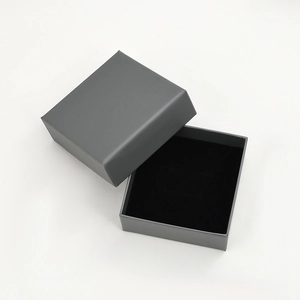 Detailed top view of a grey matte square jewelry gift box with premium black velvet lining