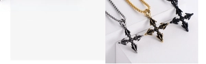 Macro detail of cross pendant in gold, silver, and black finish with vacuum plating