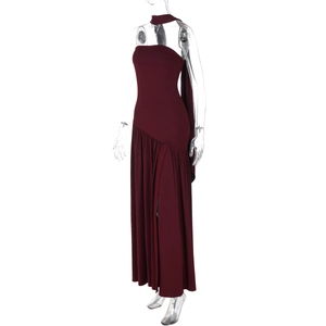 Detail view of deep red strapless dress with high side slit and elegant flowing scarf