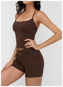 Brown yoga set featuring a cross-waist gym short with side pocket and a crop tank top