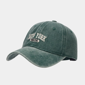 Detail of New York 1625 3D embroidery on vintage washed green cotton baseball cap