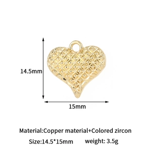 Macro detail of a gold heart pendant with lattice texture and zircon measurements