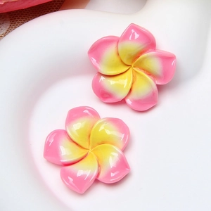 Bright resin frangipani flower accessories in pink and yellow gradient for DIY crafts
