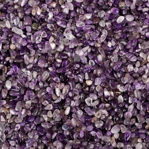 Natural purple amethyst tumbled stones with irregular polished surface and organic texture