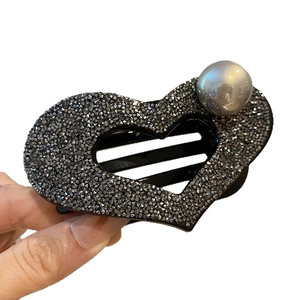 Elegant heart-shaped hair claw clip with grey rhinestones and a large pearl accent