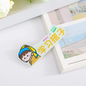 Detail of cartoon girl acrylic hair clip with art pattern and easy study text