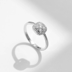 Minimalist D color moissanite ring in S925 sterling silver on a white background