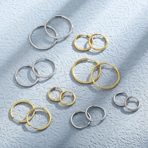 Polished stainless steel hoop earrings set in various sizes and gold and silver finishes