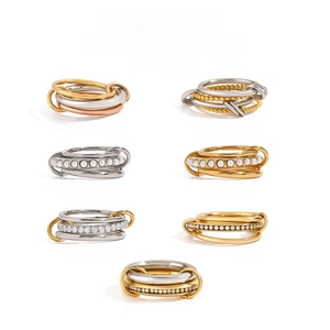 Collection of multi-layer linked stainless steel rings with gold plating and zircons