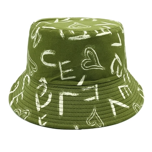 Close-up of a dark green bucket hat with heart graffiti and fine stitched brim